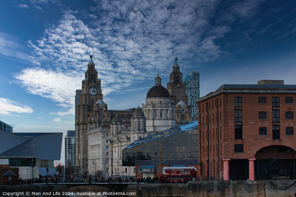 Dramatic sky over historic city buildings with modern architecture in the foreground in Liverpool, UK. Picture Board by Man And Life