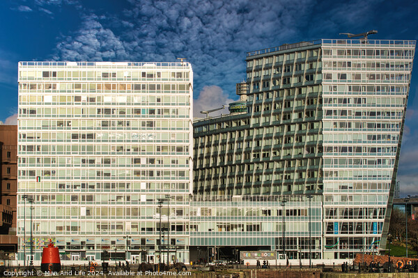 Modern office buildings with reflective glass facades against a blue sky with clouds in Liverpool, UK. Picture Board by Man And Life