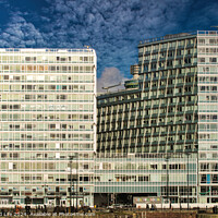 Buy canvas prints of Modern office buildings with reflective glass facades against a blue sky with clouds in Liverpool, UK. by Man And Life