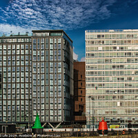 Buy canvas prints of Modern office buildings with reflective glass facades under a blue sky with scattered clouds in Liverpool, UK. by Man And Life