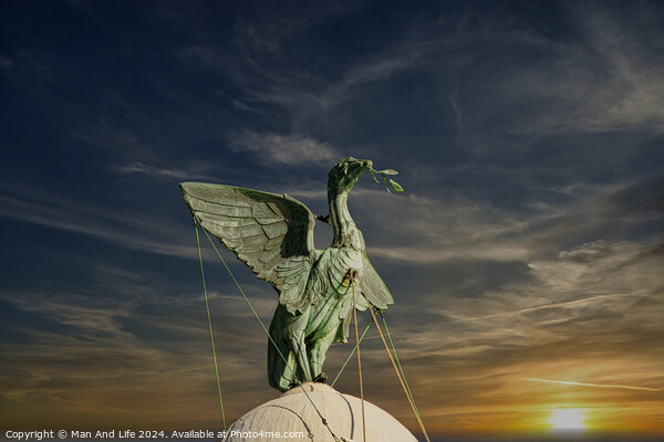 Bronze statue of an angel with outstretched wings against a vibrant sunset sky in Liverpool, UK. Picture Board by Man And Life