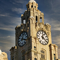 Buy canvas prints of Historic clock tower against a blue sky with clouds, architectural detail, and a statue on top in Liverpool, UK. by Man And Life