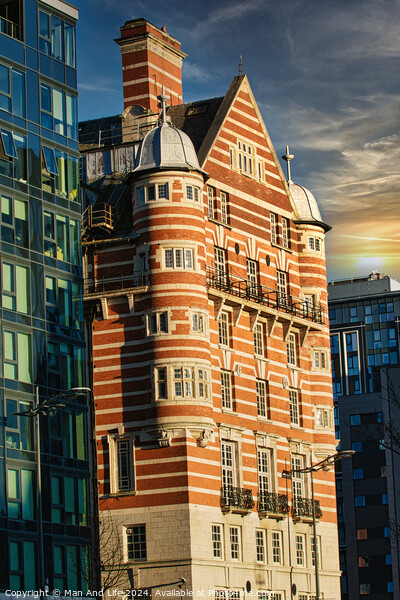 Traditional red brick building juxtaposed with modern glass facade architecture at sunset in Liverpool, UK. Picture Board by Man And Life