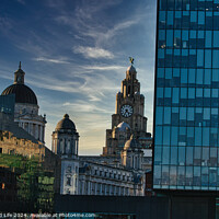 Buy canvas prints of Contrast of old and new architecture with historic domes beside a modern glass skyscraper against a dusk sky in Liverpool, UK. by Man And Life