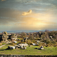 Buy canvas prints of Picturesque rural landscape at sunset with rocky formations and green fields under a cloudy sky at Brimham Rocks, in North Yorkshire by Man And Life