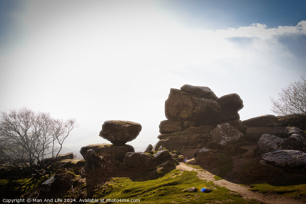 Misty landscape with balancing rock formations and a clear path under a bright sky at Brimham Rocks, in North Yorkshire Picture Board by Man And Life