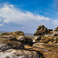 Buy canvas prints of Scenic view of rugged rocks against a blue sky with fluffy clouds, highlighting the natural beauty of a mountainous landscape at Brimham Rocks, in North Yorkshire by Man And Life