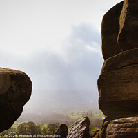 Buy canvas prints of Scenic view of a landscape through rock formations under a cloudy sky at Brimham Rocks, in North Yorkshire by Man And Life