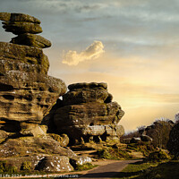 Buy canvas prints of Scenic view of unique rock formations under a golden sunset sky with lush greenery in the foreground at Brimham Rocks, in North Yorkshire by Man And Life