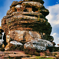 Buy canvas prints of Majestic rock formation under blue sky with clouds, showcasing natural erosion and geological layers at Brimham Rocks, in North Yorkshire by Man And Life