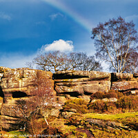 Buy canvas prints of Scenic view of a rocky outcrop with a lone tree against a blue sky with a faint rainbow in the countryside at Brimham Rocks, in North Yorkshire by Man And Life