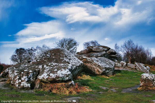 Rugged landscape with moss-covered rocks under a cloudy sky at Brimham Rocks, in North Yorkshire Picture Board by Man And Life