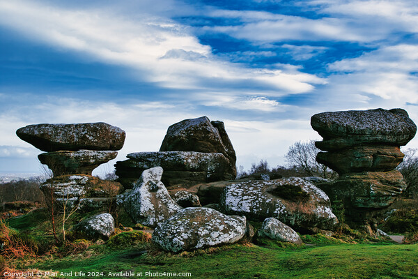 Scenic view of unique rock formations under a blue sky with clouds at Brimham Rocks, in North Yorkshire Picture Board by Man And Life