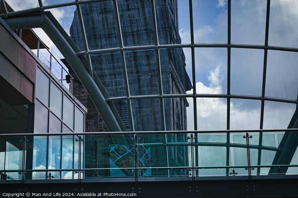 Modern glass building facade with reflections of clouds, showcasing contemporary architecture and design in Leeds, UK. Picture Board by Man And Life