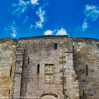 Buy canvas prints of Medieval stone fortress against a vibrant blue sky with fluffy clouds, showcasing ancient architecture and historical military construction in York, North Yorkshire, England. by Man And Life