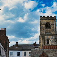Buy canvas prints of Quaint European street with historic buildings and a prominent church tower under a dramatic sky with fluffy clouds in York, North Yorkshire, England. by Man And Life