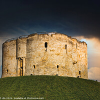 Buy canvas prints of Dramatic sky over an ancient stone fortress atop a lush green hill, symbolizing historical strength and medieval architecture in York, North Yorkshire, England. by Man And Life