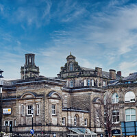 Buy canvas prints of Classic European architecture under a dynamic sky with wispy clouds, showcasing historic buildings with intricate facades in an urban setting in Harrogate, North Yorkshire. by Man And Life