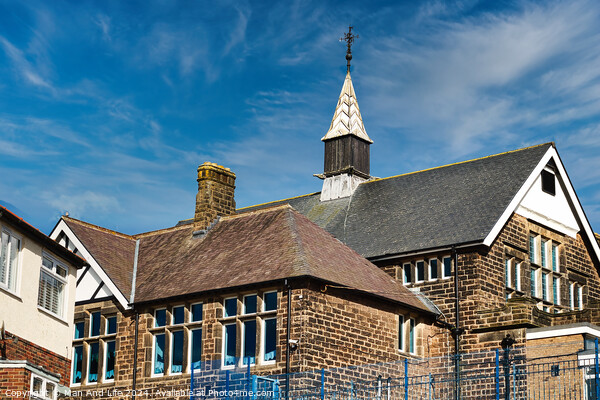Traditional brick school building with a spire against a blue sky with wispy clouds in Harrogate, North Yorkshire. Picture Board by Man And Life