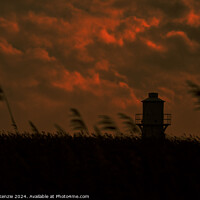 Buy canvas prints of Lighthouse under a cloudy sky  by Neil McKenzie
