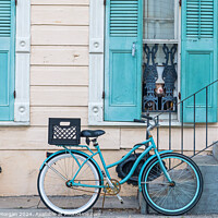 Buy canvas prints of Historic New Orleans French Quarter Home in Pastel Blue and Beige with Bicycle and Dogs by William Morgan