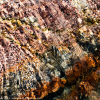 Buy canvas prints of Abstract water over coloured rocks by Paul Edney