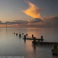 Buy canvas prints of Hunstanton seafront golden clouds at sunset by Paul Edney