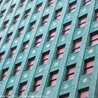 Buy canvas prints of Blue Brick Building with Pink Windows by Tom Windeknecht