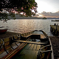 Buy canvas prints of Rowing boat on the shore at Windermere by Phil Brown