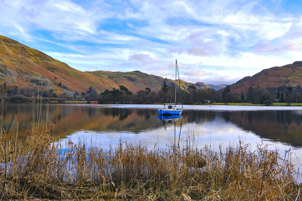 A yacht moored on Ullswater, Lake District, Cumbria. Picture Board by Phil Brown