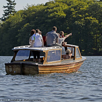 Buy canvas prints of Family on small wooden motor launch, Windermere, Lake District. by Phil Brown