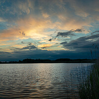 Buy canvas prints of Clouds after sunset over the lake with reeds by Dariusz Banaszuk