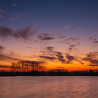 Buy canvas prints of Colorful evening sky after sunset over the lake by Dariusz Banaszuk