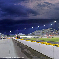 Buy canvas prints of Storm clouds over a Speedway pit lane by Pete Klinger