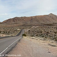 Buy canvas prints of Valley of Fire highway, road into distant mountain by Pete Klinger