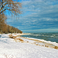 Buy canvas prints of Snow on lake shore in Winter by Pete Klinger