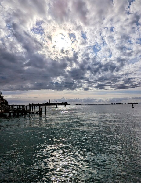 Clouds over Venice lagoon Picture Board by Robert Galvin-Oliphant