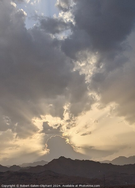 Dramatic sunset clouds over mountains  Picture Board by Robert Galvin-Oliphant