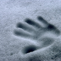 Buy canvas prints of Imprint of a young child's hand in snow by PhotoStock Israel
