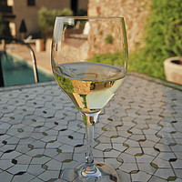 Buy canvas prints of  Close up of a chilled glass of white wine by PhotoStock Israel