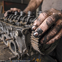 Buy canvas prints of mam fixing a motor in a workshop by PhotoStock Israel