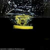 Buy canvas prints of Lemon dropped into water  by PhotoStock Israel