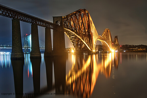 The illuminated Forth Bridge at night. Picture Board by Andrew Briggs