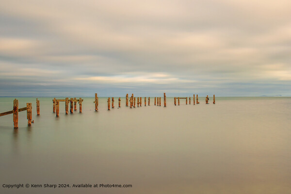 A fine art slow shutter tranquil seascape with old weathered wooden pier posts Picture Board by Kenn Sharp