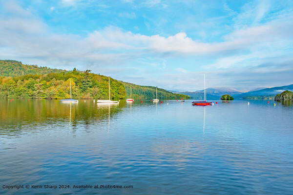 A beautiful calm view of the colourful boats on Lake Ullswater Picture Board by Kenn Sharp