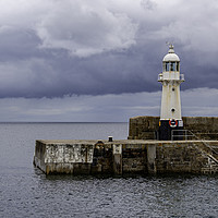 Buy canvas prints of Storm Over Mevagissey Lighthouse by James Lavott