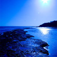 Buy canvas prints of Lyme Regis beach in blue. by mark blower
