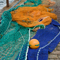 Buy canvas prints of Fishing Nets by the Harbour by Jacqi Elmslie