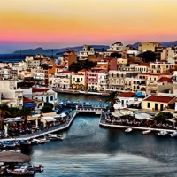 Buy canvas prints of Agios Nikolaos At Sunset by Jim kernan