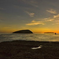 Buy canvas prints of Sunrise At Penmon lighthouse by Jim kernan